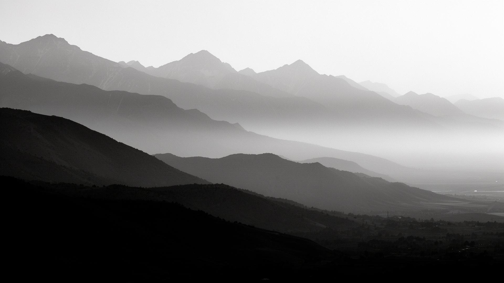 Layered Wasatch ridgelines fading into mist
